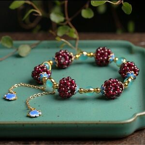 Elegant Gold and Red Beaded Bracelet